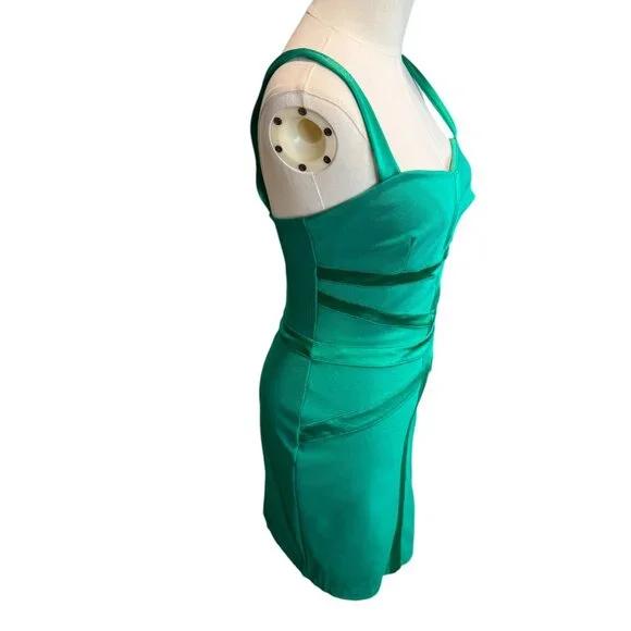 Green Bebe mini Bodycon bandage dress.Size S/P -  threedaughtersproperties.com